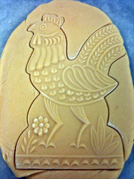 chicken-shaped cookie cut out with wood cookie mold