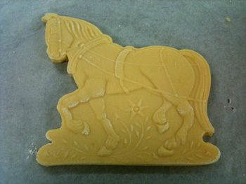 horse cookie dough cut with wood cookie cutter mold